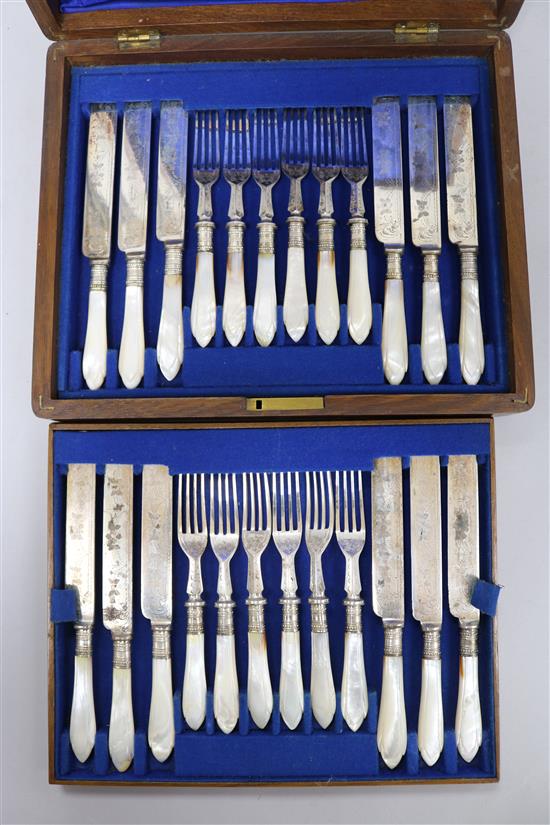 A set of twelve Victorian plated, engraved mother of pearl handled fruit knives and forks, boxed